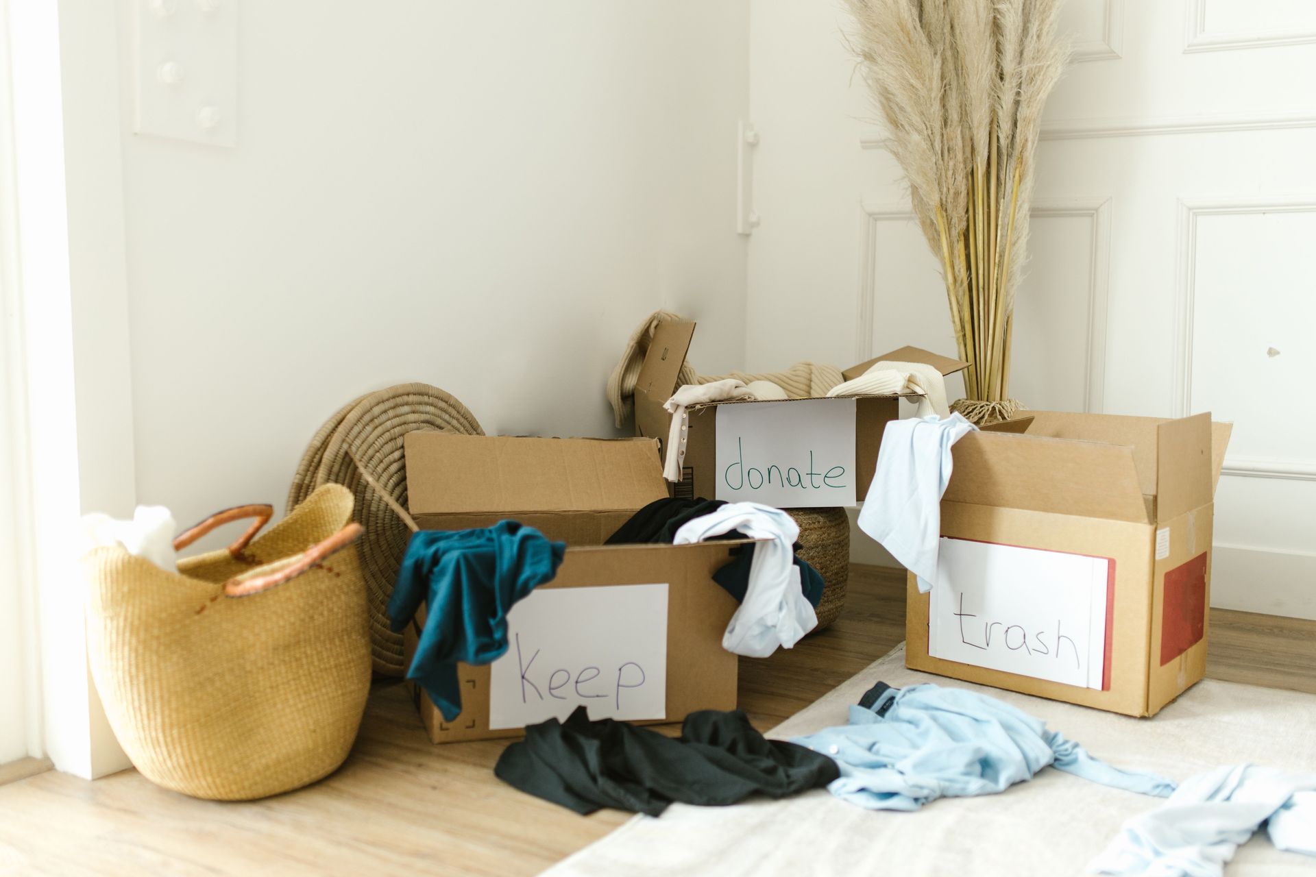 Preparing for retirement: sorting belongings into keep, donate and trash boxes