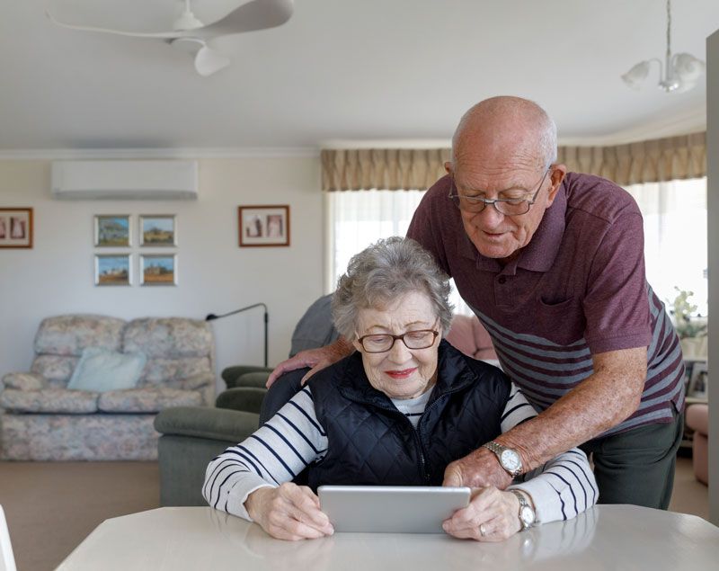 Happy senior couple enjoying retirement at an Ageing in Place village